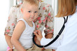 © rogerphoto - Doctor examining a child  patient by stethoscope