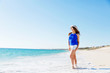 © Sergey Nivens - Young woman walking along the beach