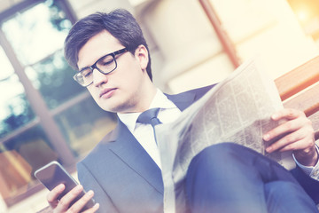 Canvas Print - Thoughtful man using smartphone