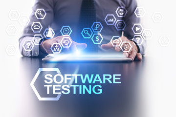 businessman is using tablet pc and selecting software testing icon.
