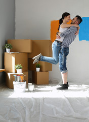 Happy young couple moving in new house