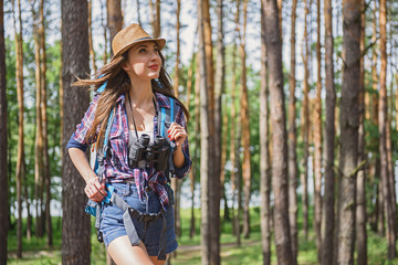 Wall Mural - Attractive female tourist enjoying nature