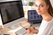 © shefkate - Young woman working in office, sitting at desk
