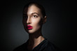© julenochek - Attractive model with pink lips and shadow casting on face