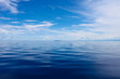 Photo of Blue Sea and Tropical Sky Clouds. Seascape. Sun over Water,Sunset. Horizontal picture.
