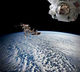 Wall Mural - planet earth astronaut spaceman helmet suit outer spacewalk international space station. elements of