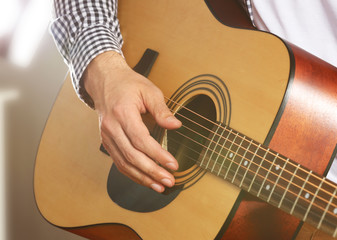 Wall Mural - Man playing acoustic guitar