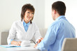 © Africa Studio - Female doctor measuring man blood pressure in clinic