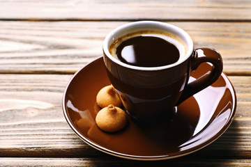 Poster - Cup of coffee with cookies on wooden table