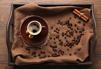 Poster - Cup of coffee with beans on wooden tray