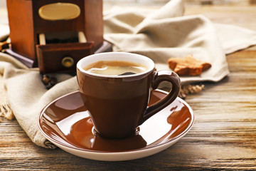 Poster - Cup of coffee on wooden table