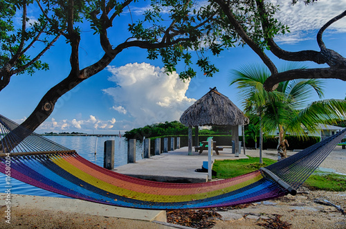 Valokuva Colorful Hammocks sit bayside at a Florida Keys vacation resort