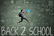 © Creativa Images - Student jumps over the text of Back to School