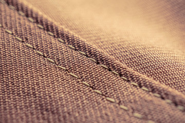 vintage tone.macro brown fabric texture with seam