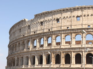 Great Colosseum in Rome, Italy, Europe. Roman Coliseum close-up with clear blue sky.