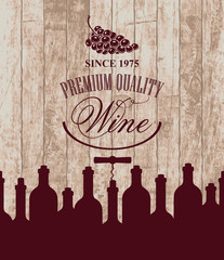 banner for the wine store or restaurant with bottles and grapes on the background of wooden boards