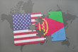puzzle with the national flag of united states of america and eritrea on a world map background.