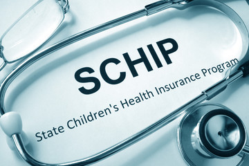 Paper with words SCHIP State Children's Health Insurance Program.