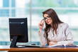© Elnur - Businesswoman sitting at the office desk