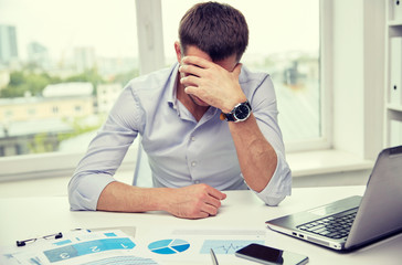 Wall Mural - stressed businessman with papers in office