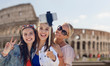 © Syda Productions - group of smiling women taking selfie in rome