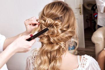 Beauty wedding hairstyle. Bride. Blond girl with curly hair styling