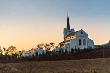 Wall Mural - beautiful sunrise view of church on a hill