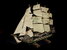Old Antique Model Ship On Black Background