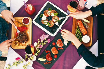 A beautiful decorated table in the restaurant with delicious dishes. The concept of a romantic dinner for lovers