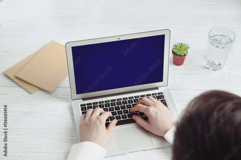 Businessman working on laptop indoors