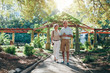 © Jacob Lund - Happy senior couple walking together in a city park