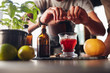 © Jacob Lund - Bartender preparing negroni cocktail