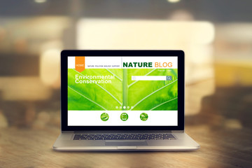 laptop with nature website on the screen in room background, all are designed up