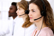 © rogerphoto - Call center operator.Young beautiful business woman in headset.
