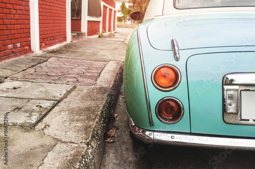 Obraz na plátne Rear view of classic car parked on street in city - vintage retro color effect s