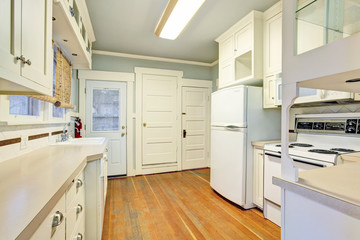 White empty simple old kitchen room with hardwood flooring