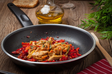 Canvas Print - Fried chicken pieces with vegetables.