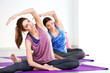 © Africa Studio - Young women with mats in gym