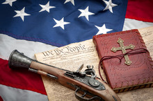 The Constitution Protects Among Others Both The Right To Bear Arms And Freedom Of Religion, Illustrated With A Musket Type Pistol ( Flintlock Pistol ) And A Bible