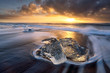© Colby Brown - Long exposure, iceberg on black sand beach at sunset, iceland