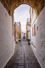 Traditional Street With White Houses In Lindos Village, Rhodes Island, Dodecanese, Greece.