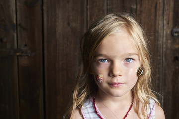 Wall Mural - Portrait of cute blond child girl with snail on her face