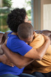 © digitalskillet1 - African American mother hugging her son.