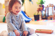 © Tierney - Toddler girl playing in her house