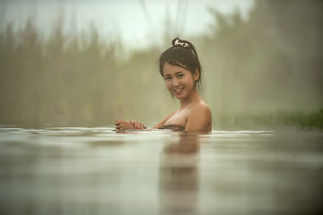 Pretty girls taking bath in japanese style onsen hot springs