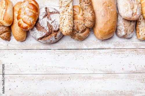 Fotografie, Obraz Delicious fresh bread on wooden background