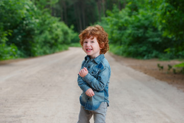 cute little emotional boy outdoors