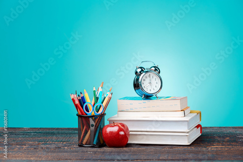 Stampa su Tela Back to School concept. Books, colored pencils and clock
