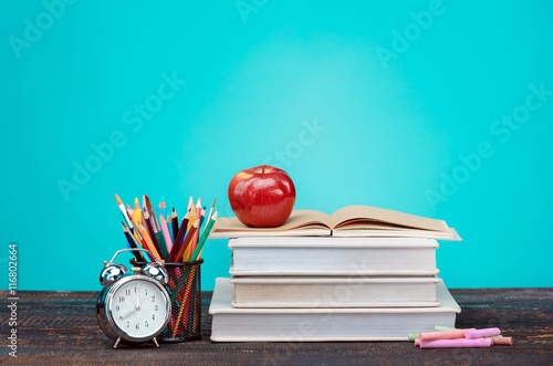 Stampa su Tela Back to School concept. Books, colored pencils and clock