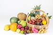 Tropical fruits inside basket with background